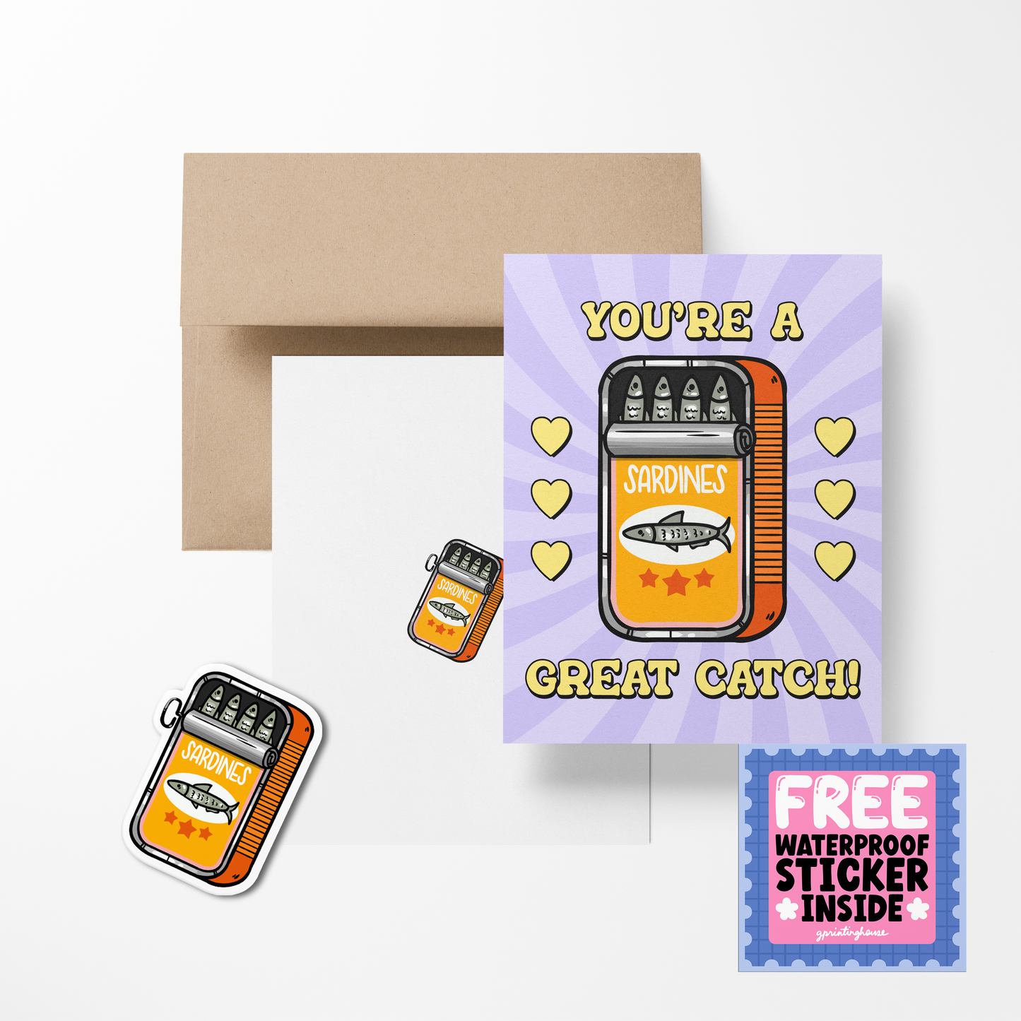 A greeting card with a cute food-themed design, featuring a sandwich and hearts, accompanied by a brown envelope and a free waterproof vinyl sticker.