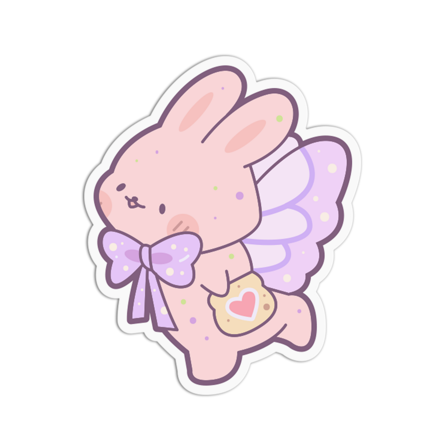 A die-cut sticker featuring a cute pastel pink bunny angel character with purple wings, a purple polka-dot bow, and a small heart-shaped cookie, shown on a plain white background.