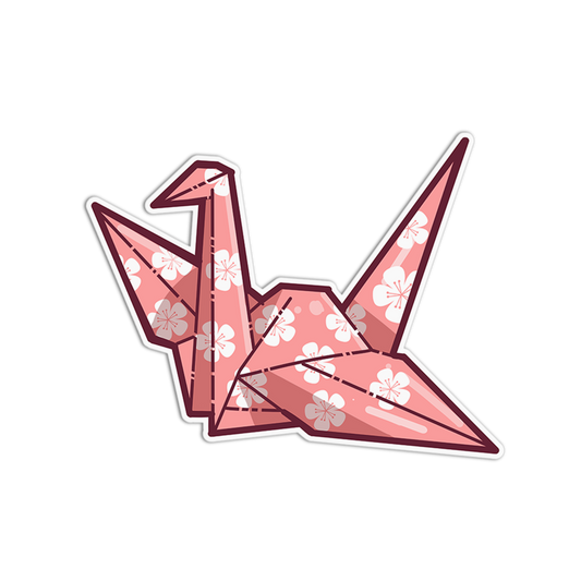 Pink origami crane with white floral patterns on a white background