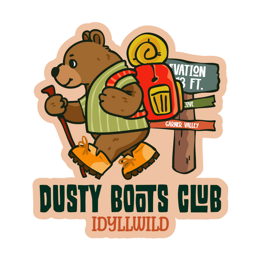Sticker with a bear character and 'Dusty Boots Club Idyllwild' text on a white background