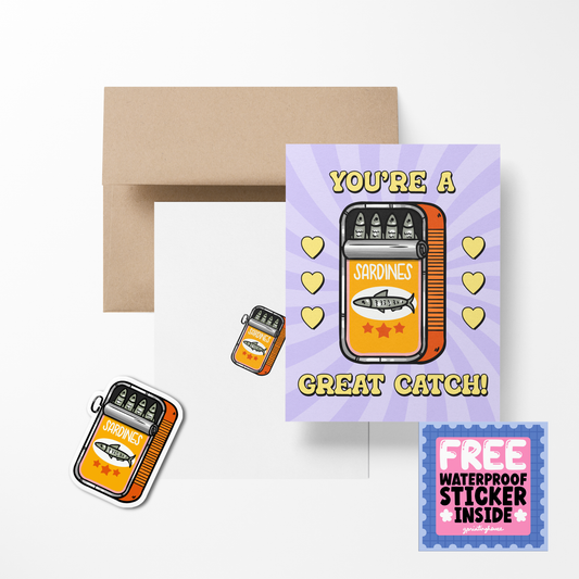 A greeting card with a cute food-themed design, featuring a sandwich and hearts, accompanied by a brown envelope and a free waterproof vinyl sticker.