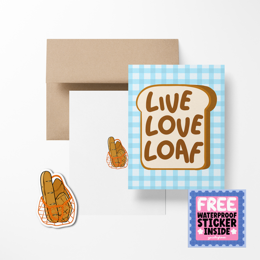 A greeting card with a bread slice design and the text 'LIVE LOVE LOAF', accompanied by a brown envelope and a free waterproof vinyl sticker, all displayed on a white background.