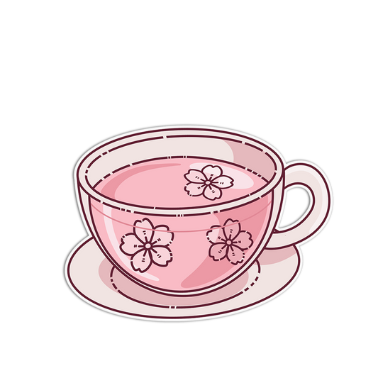Pink teacup with cherry blossom design on a white background