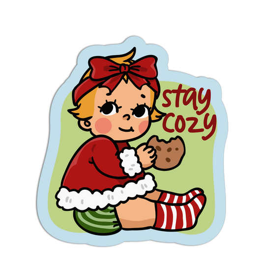 Illustration of a child in winter clothing holding a cookie with 'stay cozy' text on a white background.
