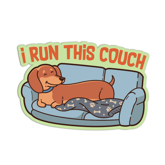 Sticker with a dachshund on a couch and 'I Run This Couch' text.
