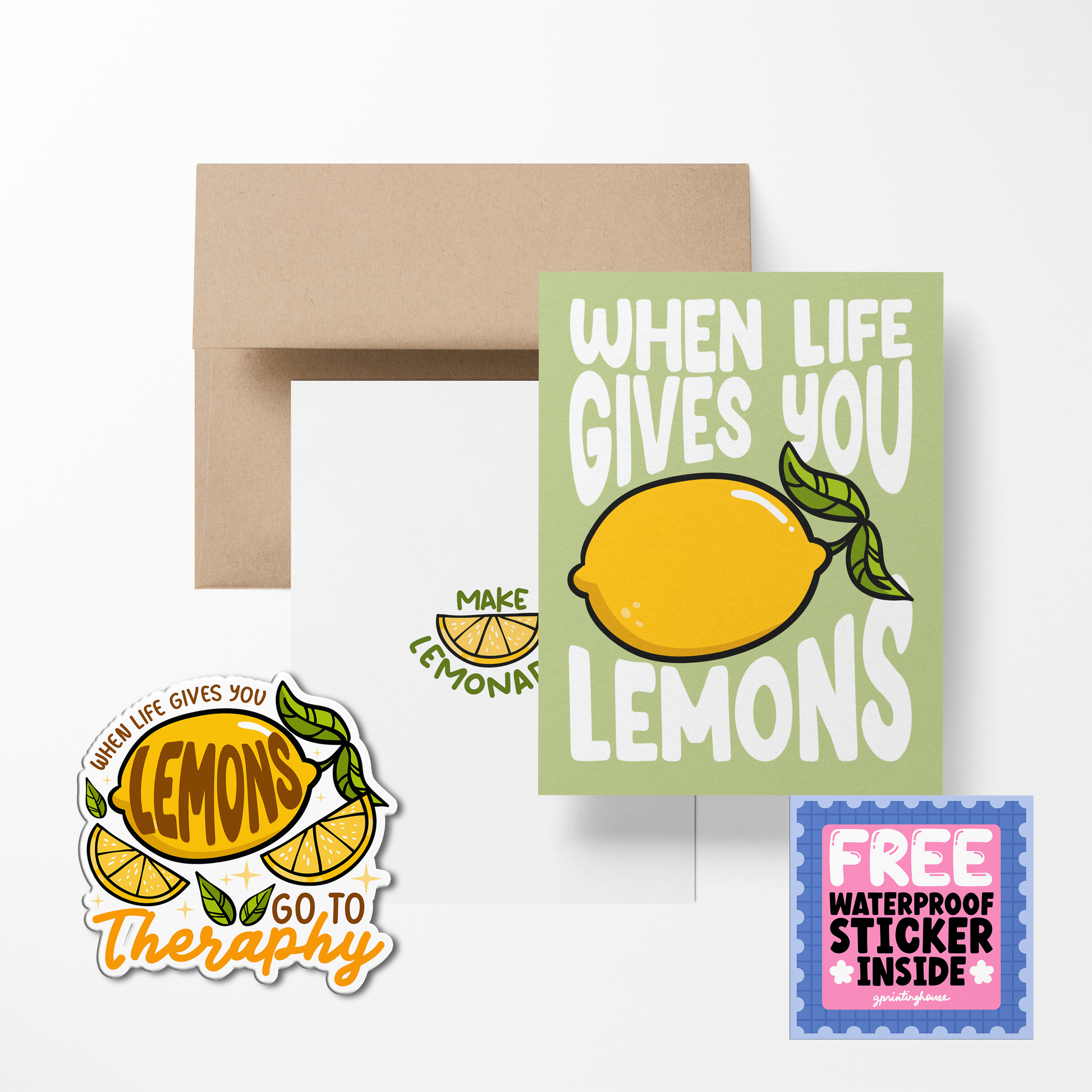 A greeting card with a lemon illustration and a text play on the phrase 'when life gives you lemons', accompanied by a free waterproof vinyl sticker, displayed with an envelope.