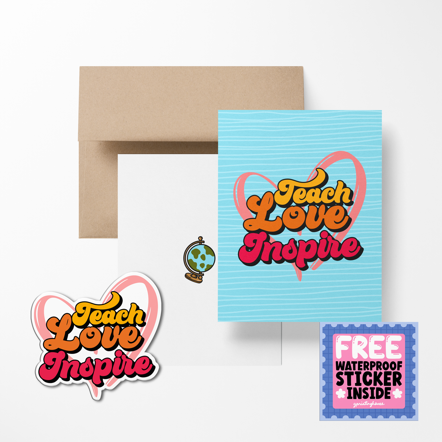 A greeting card with 'Teach Love Inspire' text, accompanied by a sticker with the same text, a brown envelope, and a blue card.