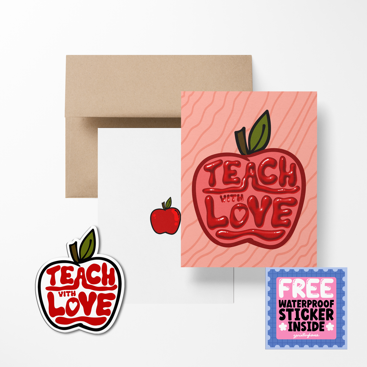 A greeting card with 'TEACH WITH LOVE' text in the shape of an apple, accompanied by a sticker with the same design. A brown envelope is also shown.