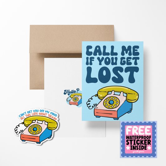 A greeting card with a playful telephone design and the text 'CALL ME IF YOU GET LOST', accompanied by a sticker and envelope.