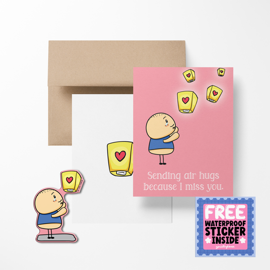 A greeting card with a cartoon character sending air hugs, with a sticker that matches the card, and a kraft paper envelope.
