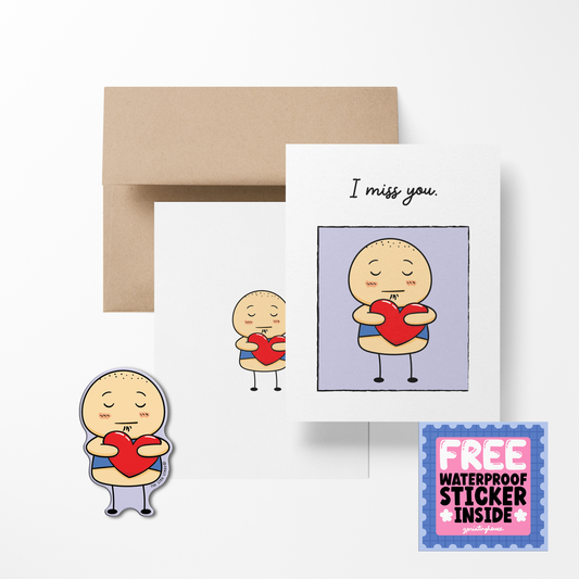 A greeting card with a cartoon potato character holding a heart, with the text 'I miss you.' Accompanied by a brown kraft envelope and a free waterproof vinyl sticker.