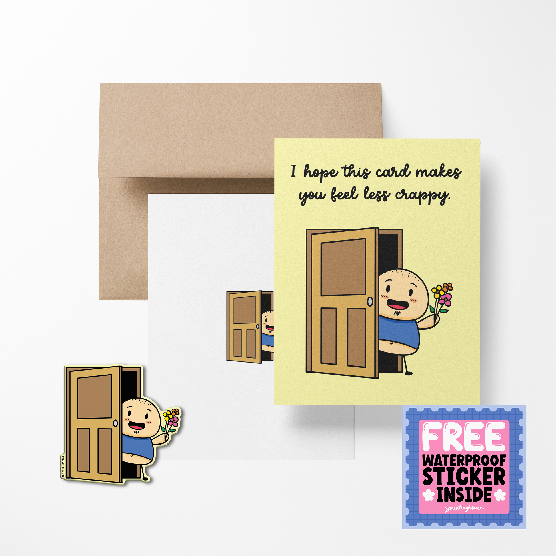 A greeting card with a cartoon character delivering a bouquet, with the text 'I hope this card makes you feel less crappy.' A brown envelope and a free waterproof vinyl sticker are also shown.
