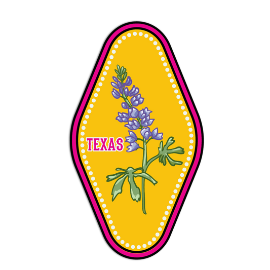 Decorative patch with purple flowers and 'TEXAS' text on a yellow background
