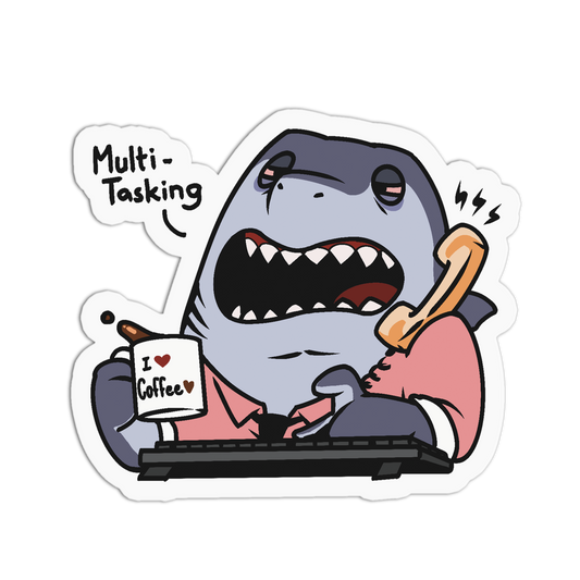 A cartoon shark character sticker or decal shown on a plain white background. The shark is wearing a pink shirt, typing on a keyboard, holding a phone, and holding a mug that says 'I ♥ Coffee'.
