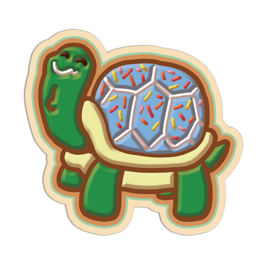 Tortoise-shaped cookie with a blue filling and colorful sprinkles on a white background