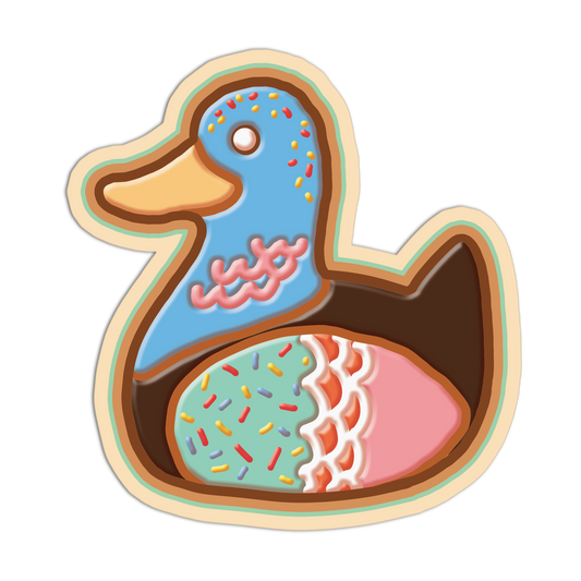 Cookie cutter shaped like a duck with colorful sprinkles on a white background