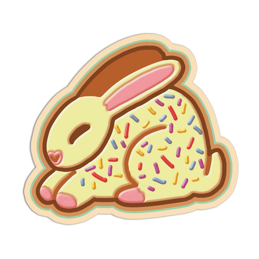 Cookie-shaped sticker with a rabbit design and colorful sprinkles on a white background