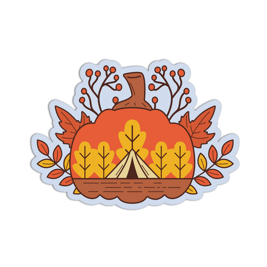 A die-cut sticker featuring an autumn camping theme, with a large orange pumpkin, a beige teepee tent, yellow and orange leaves, and brown branches on a white background.