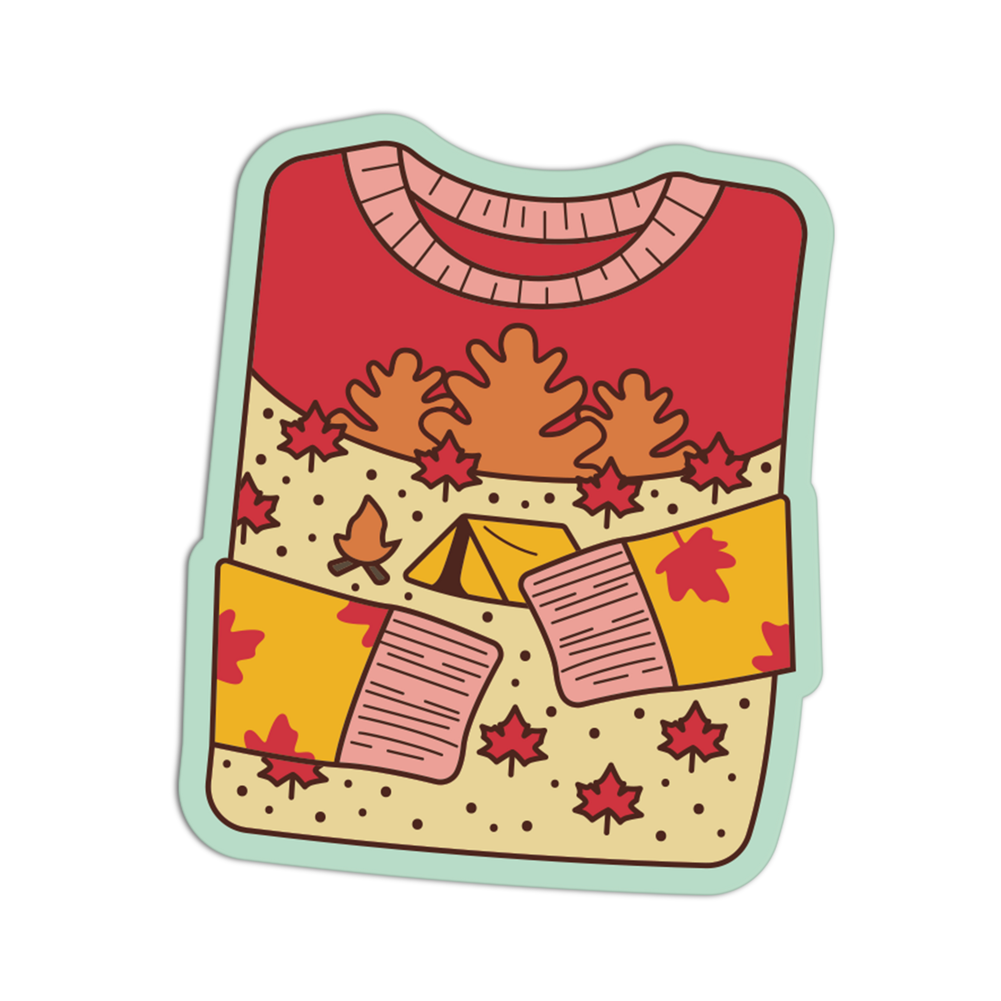 A die-cut sticker or decal featuring a cozy autumn sweater illustration with a red top, beige dotted body, orange trees, red maple leaves, a small yellow tent, and pink-and-beige mittens, shown on a plain white background.