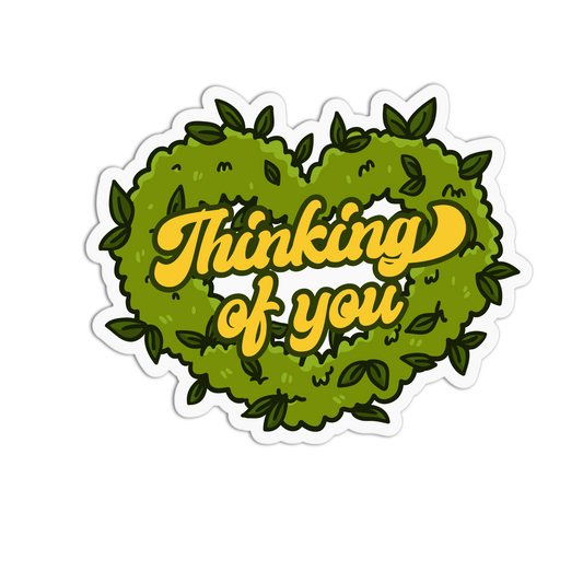 Heart-shaped wreath with 'Thinking of you' text on a white background