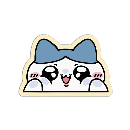 A cute cartoon cat face sticker or decal with a blue bow, large black eyes, pink cheeks, and a cream border on a plain white background.