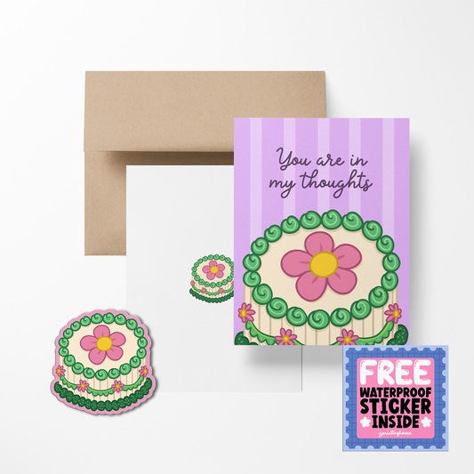 Greeting card with flower design and envelope, featuring a free sticker offer.