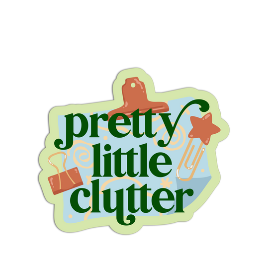 Decorative sign with 'pretty little clutter' text and office supplies on a white background