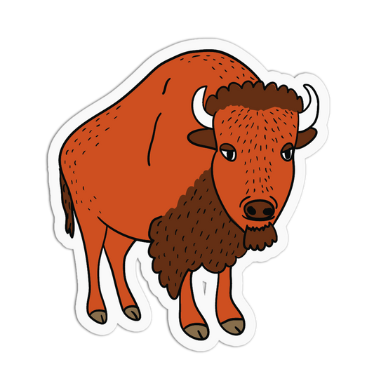 A die-cut sticker featuring a cartoon bison illustration in orange-brown and dark brown tones with white horns, shown on a plain white background.