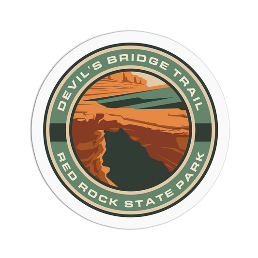 Circular sticker of Devil's Bridge Trail in Red Rock State Park with a scenic landscape.