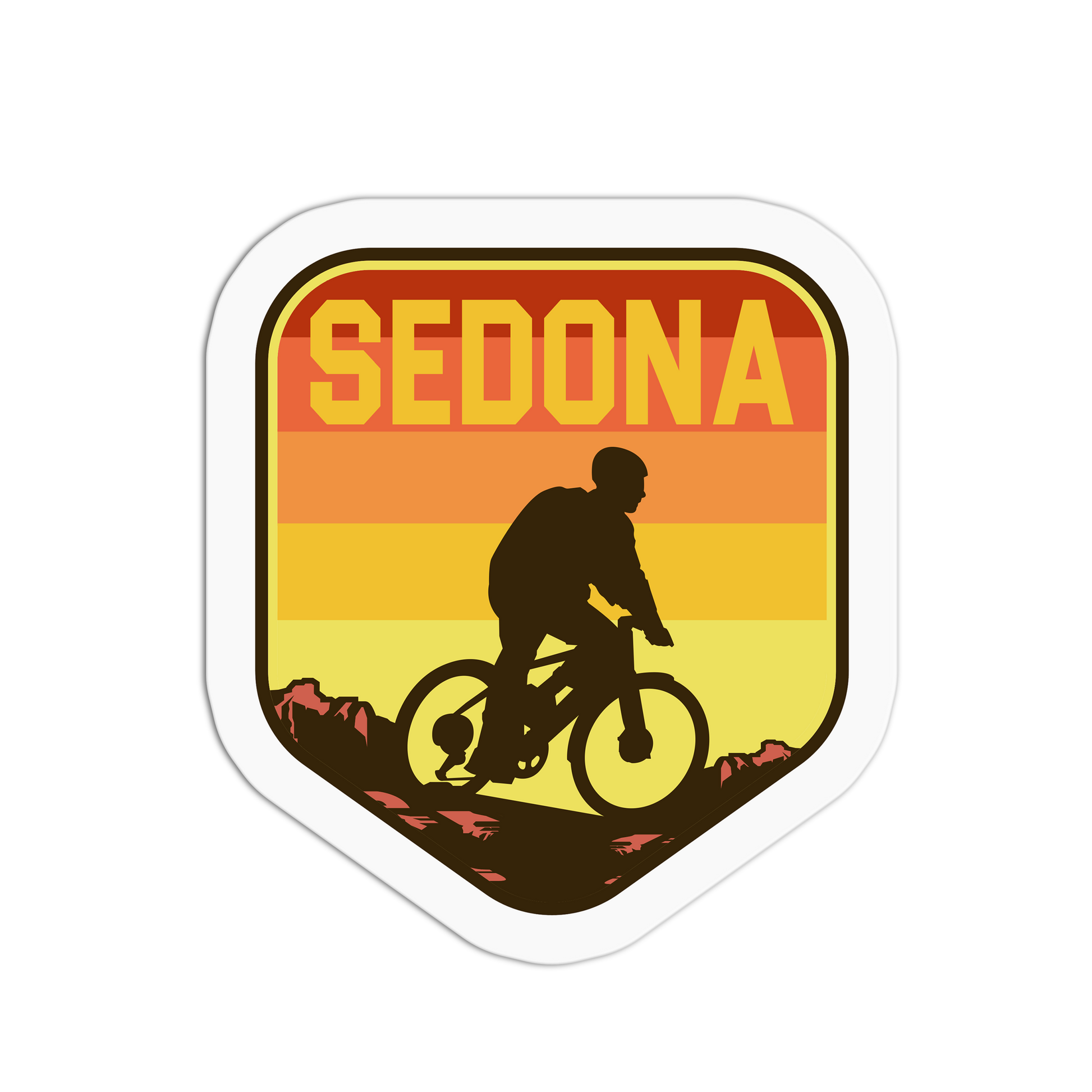Sticker with 'SEDONA' text and a silhouette of a person on a bike against a sunset background.
