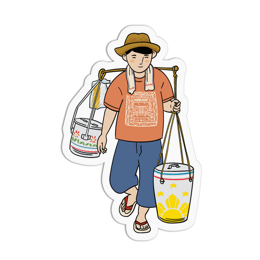 A die-cut sticker featuring a cartoon illustration of a man carrying two decorated buckets on a shoulder yoke. The man wears a brown hat, an orange graphic t-shirt, and blue shorts.