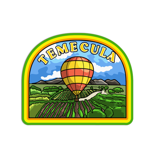 Emblem with a hot air balloon over a landscape and 'Temecula' text on a white background