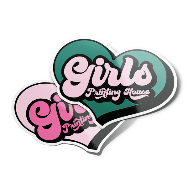 A die cut sticker with a pink and green heart shape and the text 'Girls Printing House'.