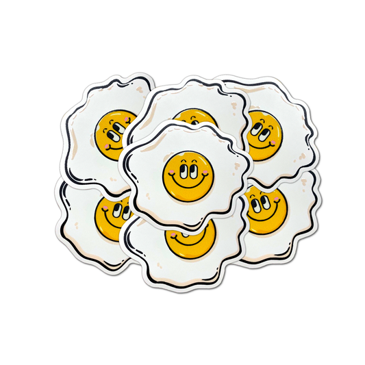 A set of round vinyl stickers with a smiley face design on a white background.